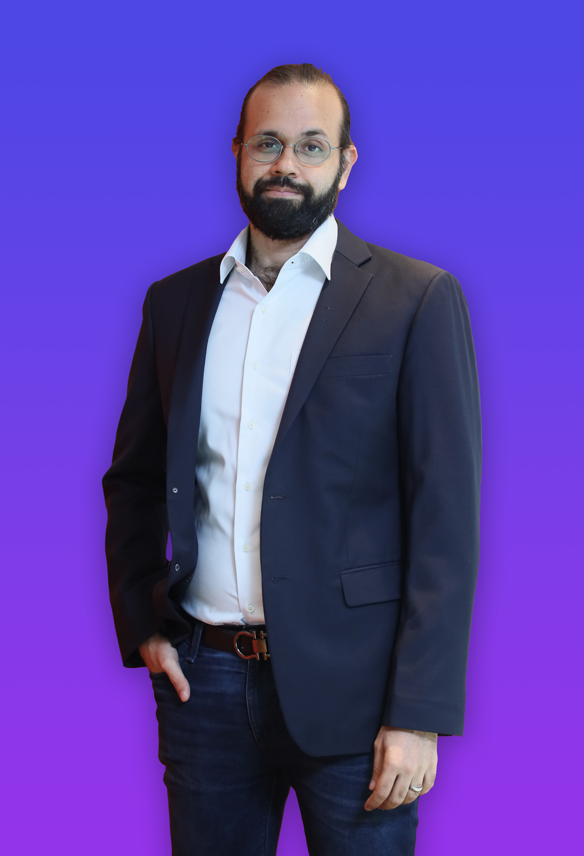 Whitney leaning against a railing on a downtown street